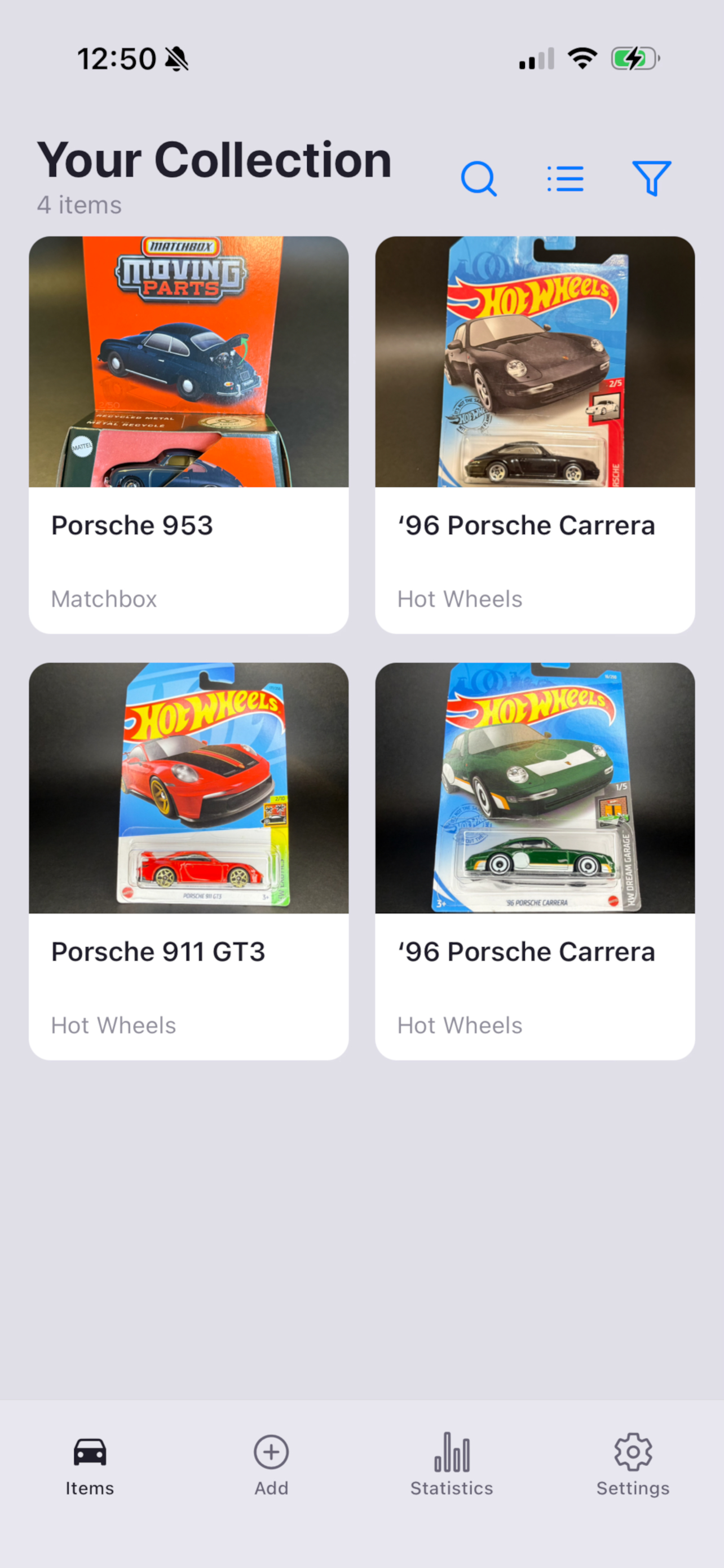Diecast Keeper collection grid view showing four cataloged model cars